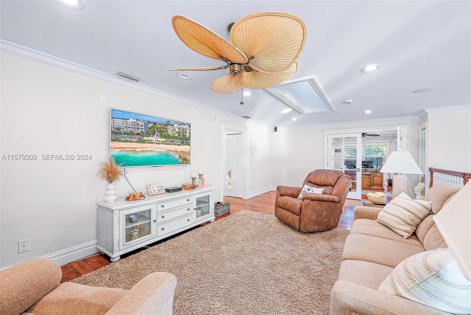 4643 Cheerio Way Stuart, FL 34997 - Photo 38 of 69 a living room with furniture and a flat screen tv