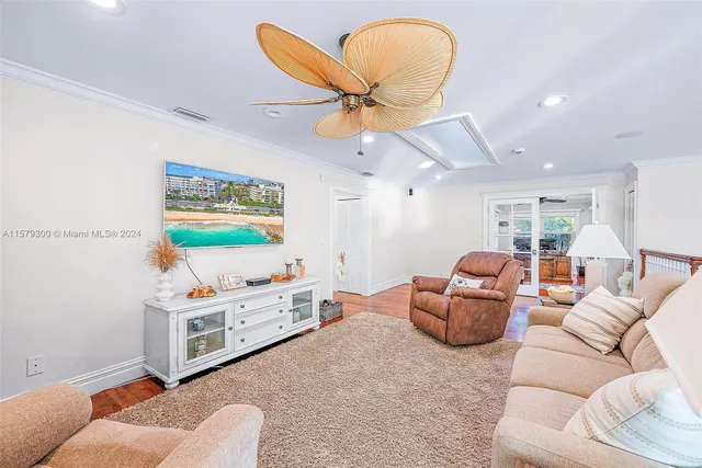 a living room with furniture and a rug