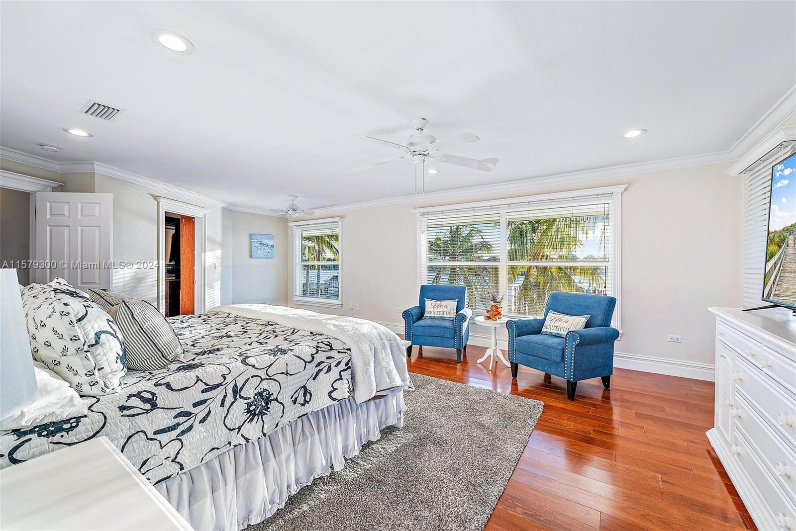 4643 Cheerio Way Stuart, FL 34997 - Photo 40 of 69 a bedroom with furniture and a large window