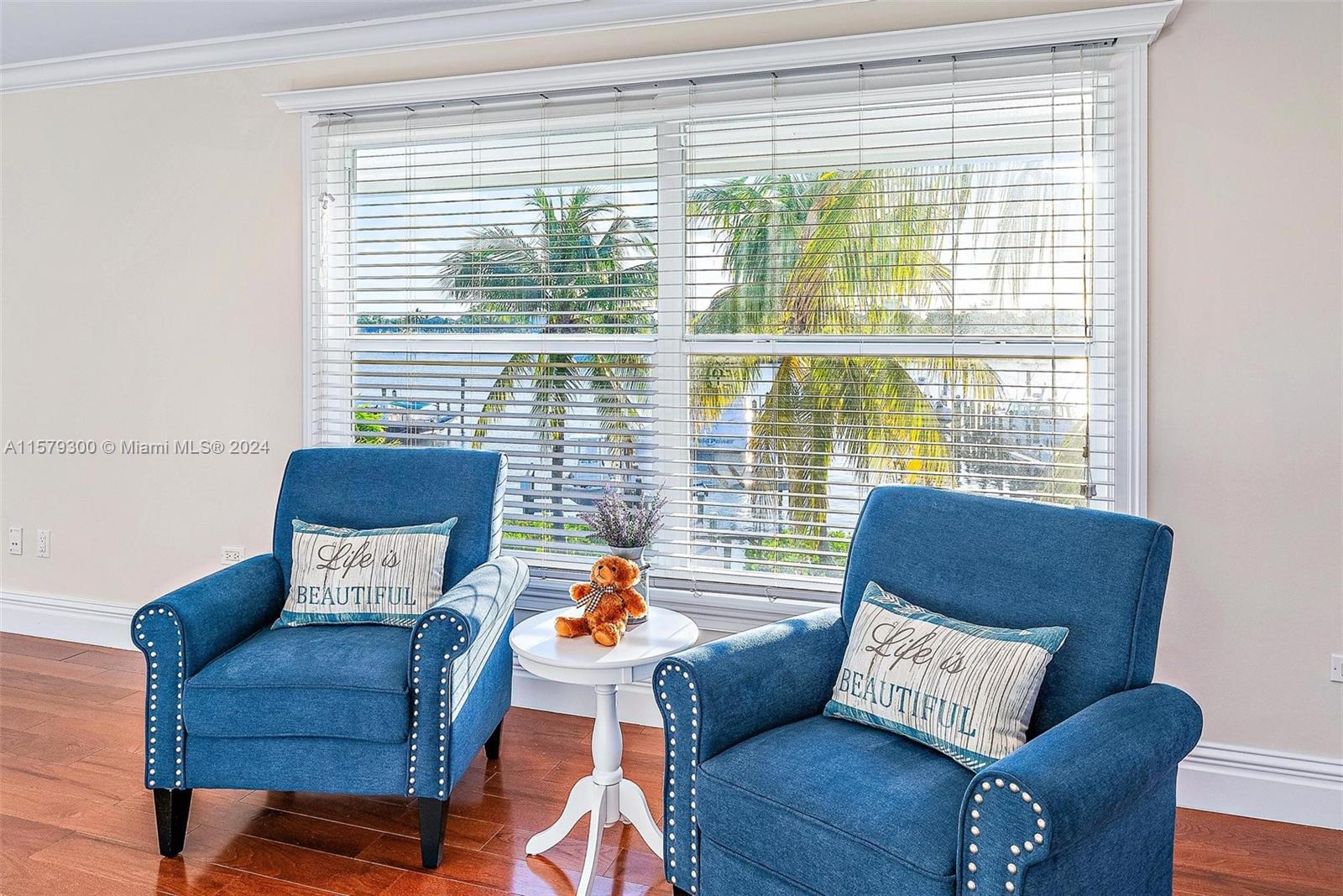 4643 Cheerio Way Stuart, FL 34997 - Photo 41 of 69 a living room with furniture and a large window