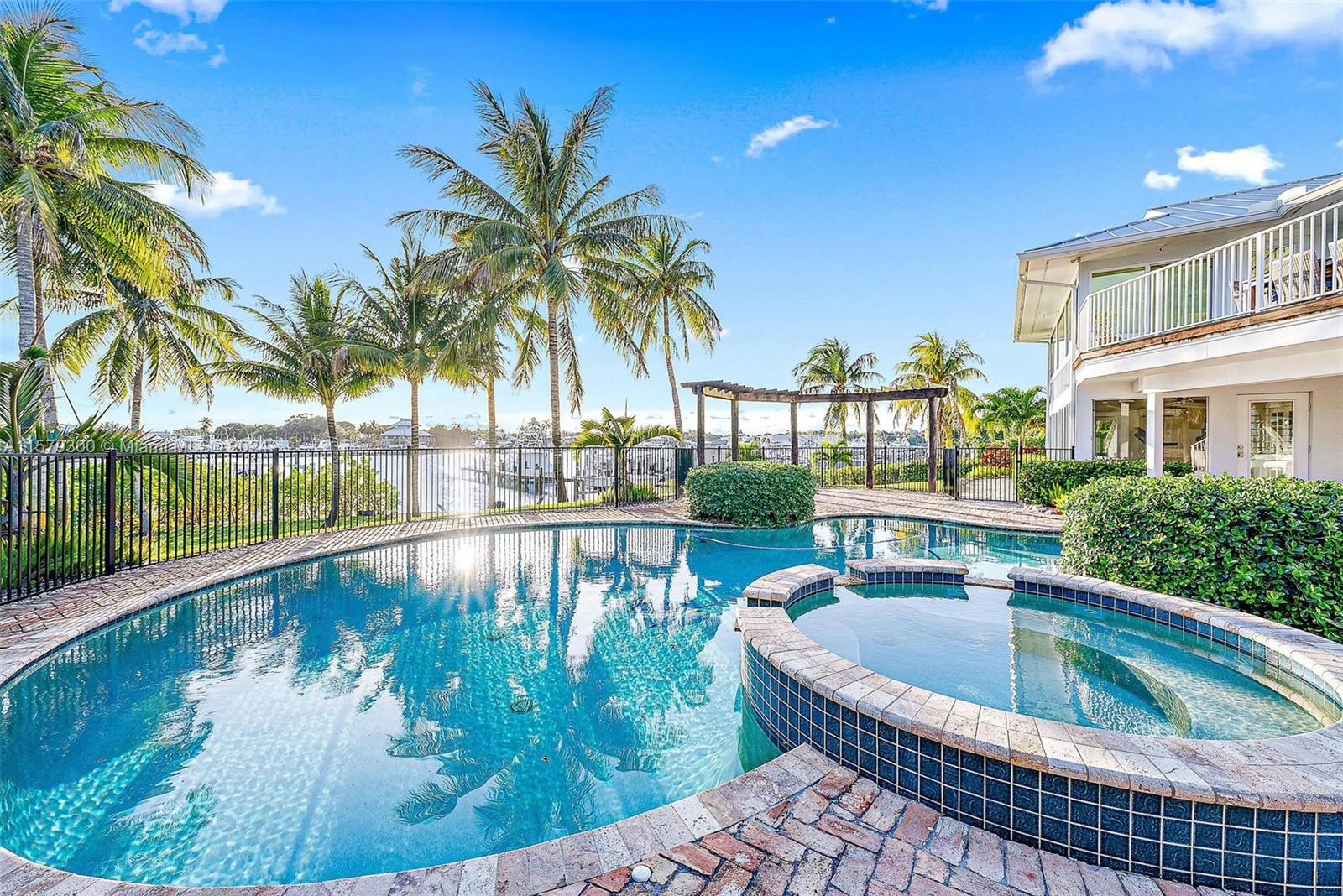 4643 Cheerio Way Stuart, FL 34997 - Photo 60 of 69 a view of swimming pool from a balcony