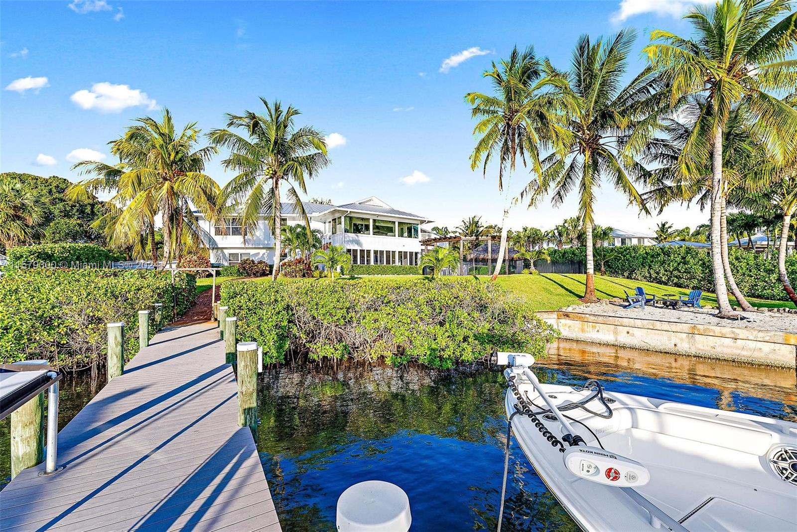 4643 Cheerio Way Stuart, FL 34997 - Photo 64 of 69 a view of a chairs and table in a patio