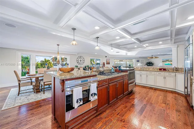 a view of a terrace with lawn chairs and a fire pit
