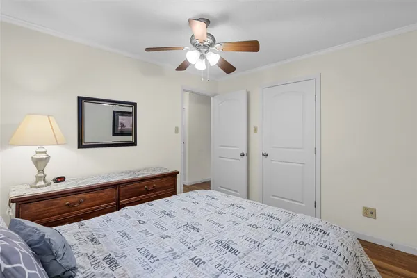 a bedroom with a bed and a dresser