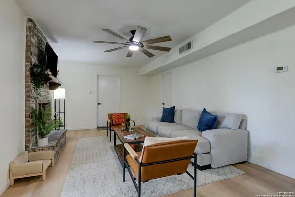 a living room with furniture and a window