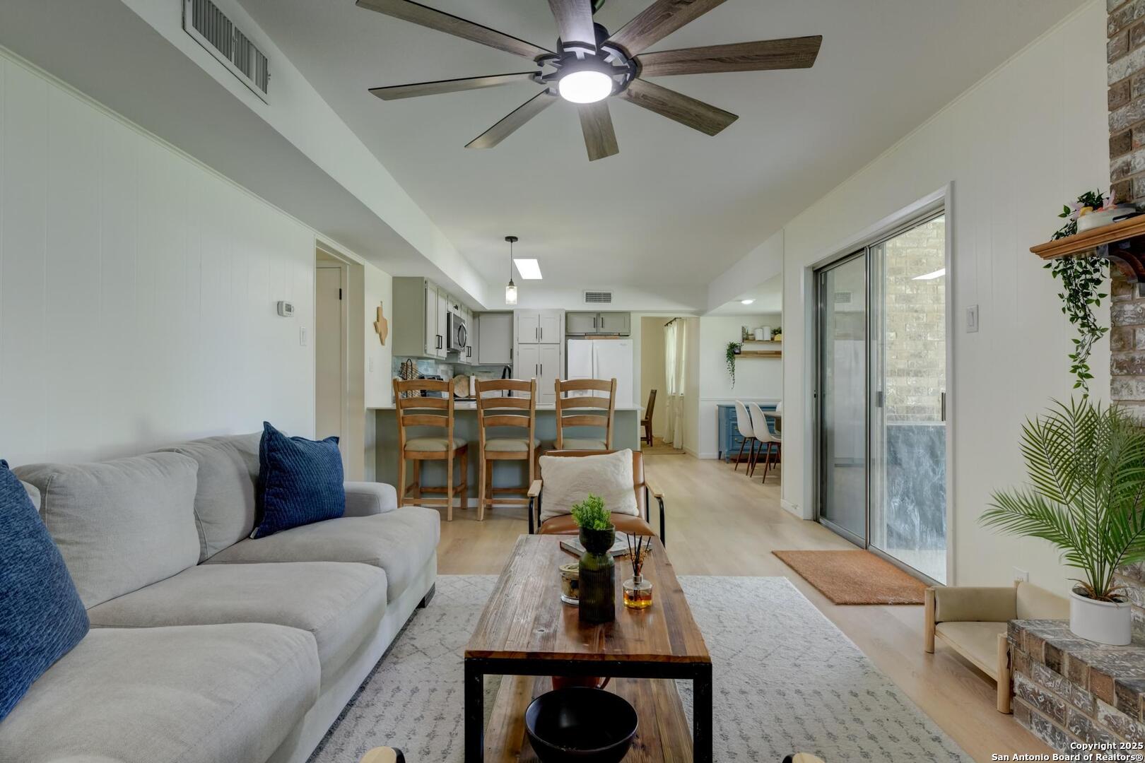 5018 Risada Street San Antonio, TX 78233 - Photo 13 of 39 a living room with furniture and a chandelier
