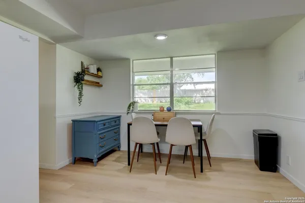 a utility room with sink dryer and washer
