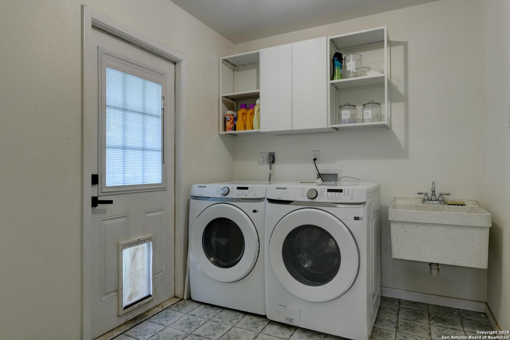 5018 Risada Street San Antonio, TX 78233 - Photo 18 of 39 a utility room with sink dryer and washer