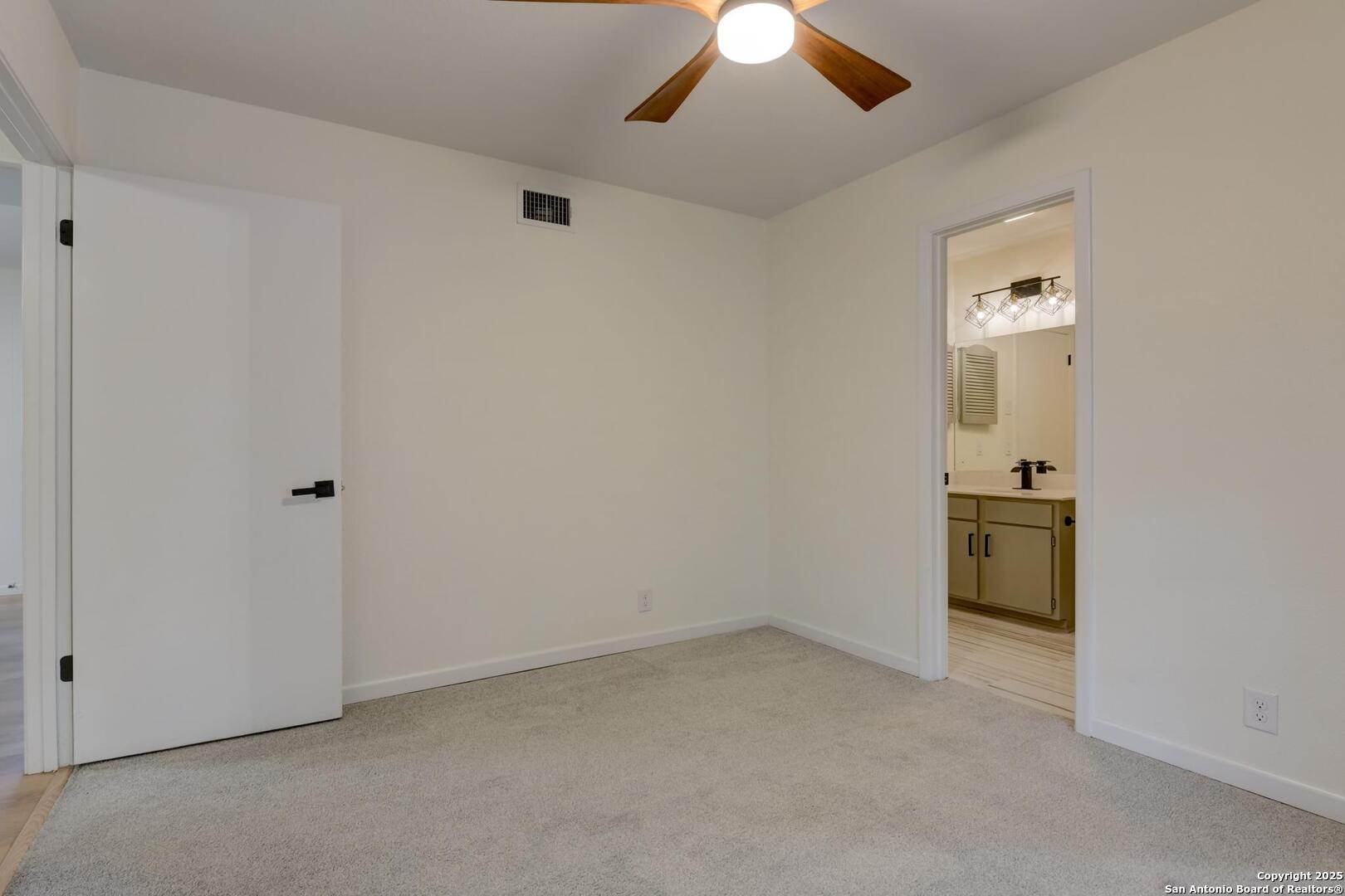 5018 Risada Street San Antonio, TX 78233 - Photo 20 of 39 an empty room with chandelier fan