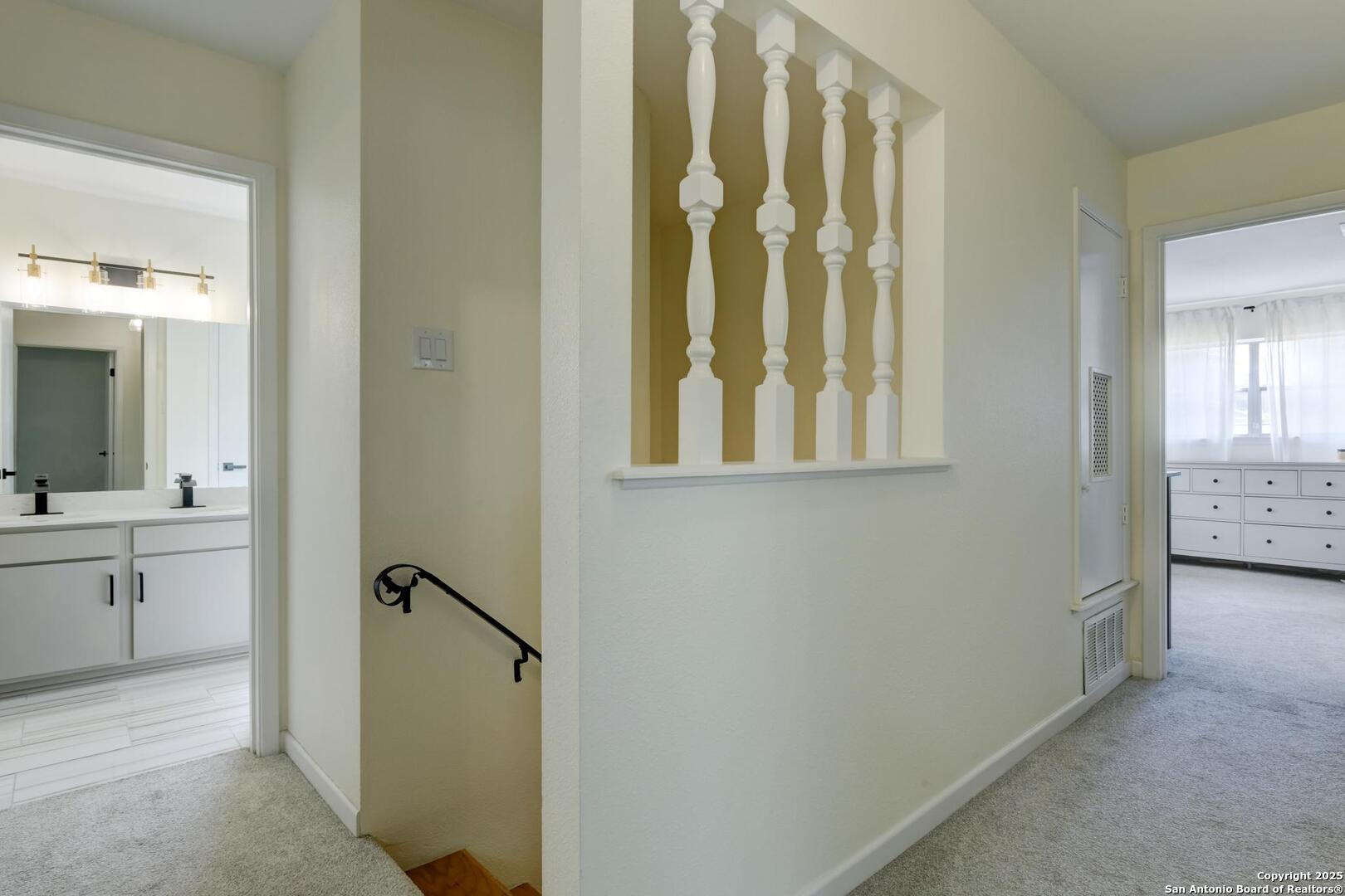 5018 Risada Street San Antonio, TX 78233 - Photo 23 of 39 a bathroom with a granite countertop sink a mirror and a bathtub