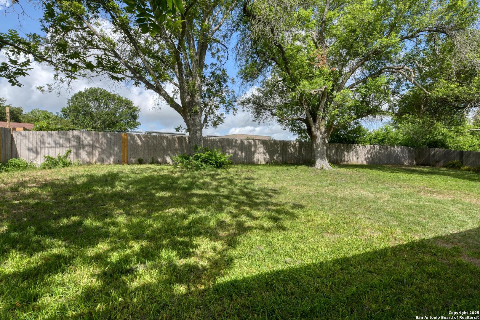 5018 Risada Street San Antonio, TX 78233 - Photo 39 of 39 a view of a backyard with large trees