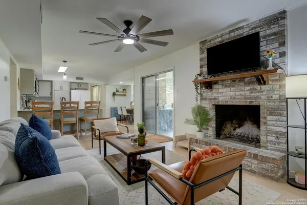 a living room with furniture and a fireplace
