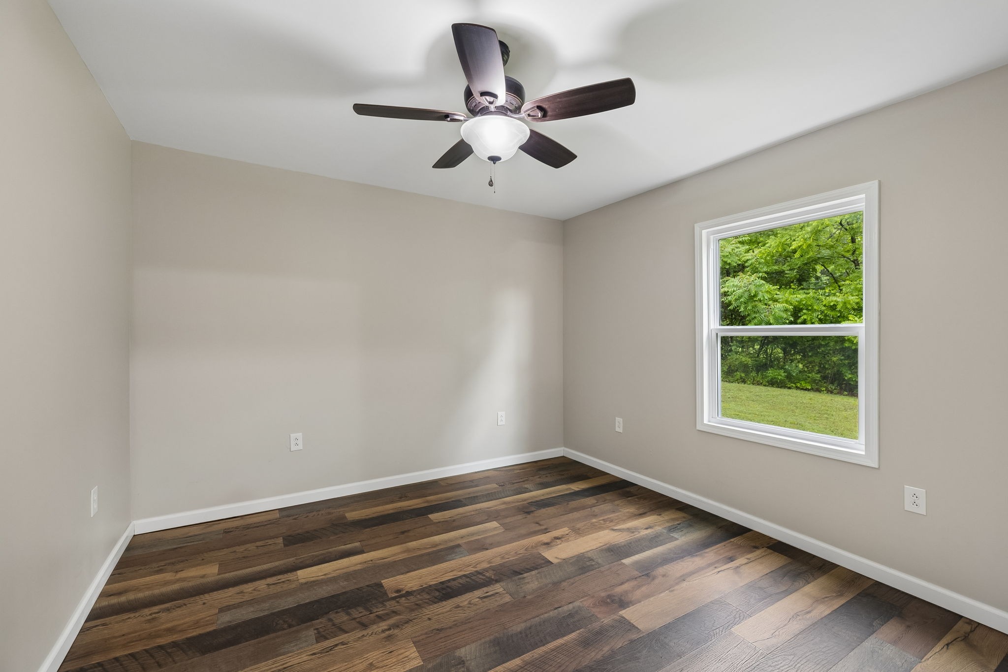 121 Hannah Road Summertown, TN 38483 - Photo 23 of 52 wooden floor in an empty room with a window