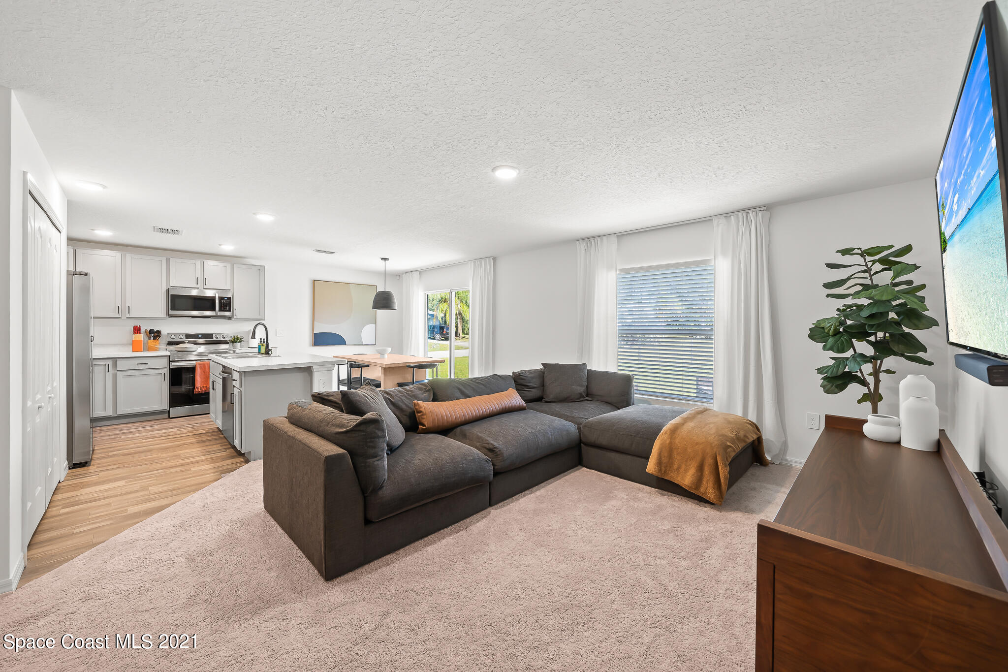 271 Wendover Road Southwest Palm Bay, FL 32908 - Photo 12 of 35 a living room with furniture and a large window