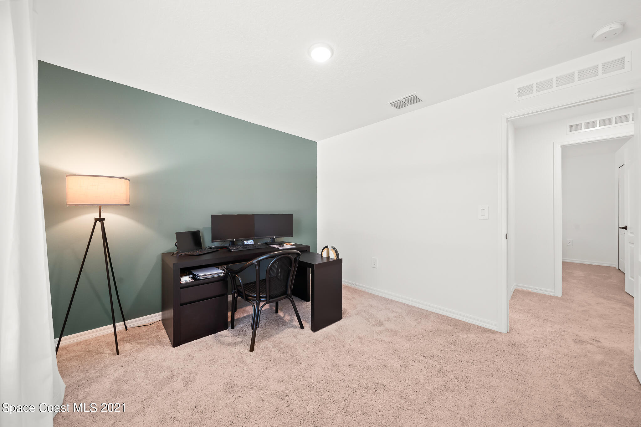 271 Wendover Road Southwest Palm Bay, FL 32908 - Photo 14 of 35 a workspace with furniture and lamp