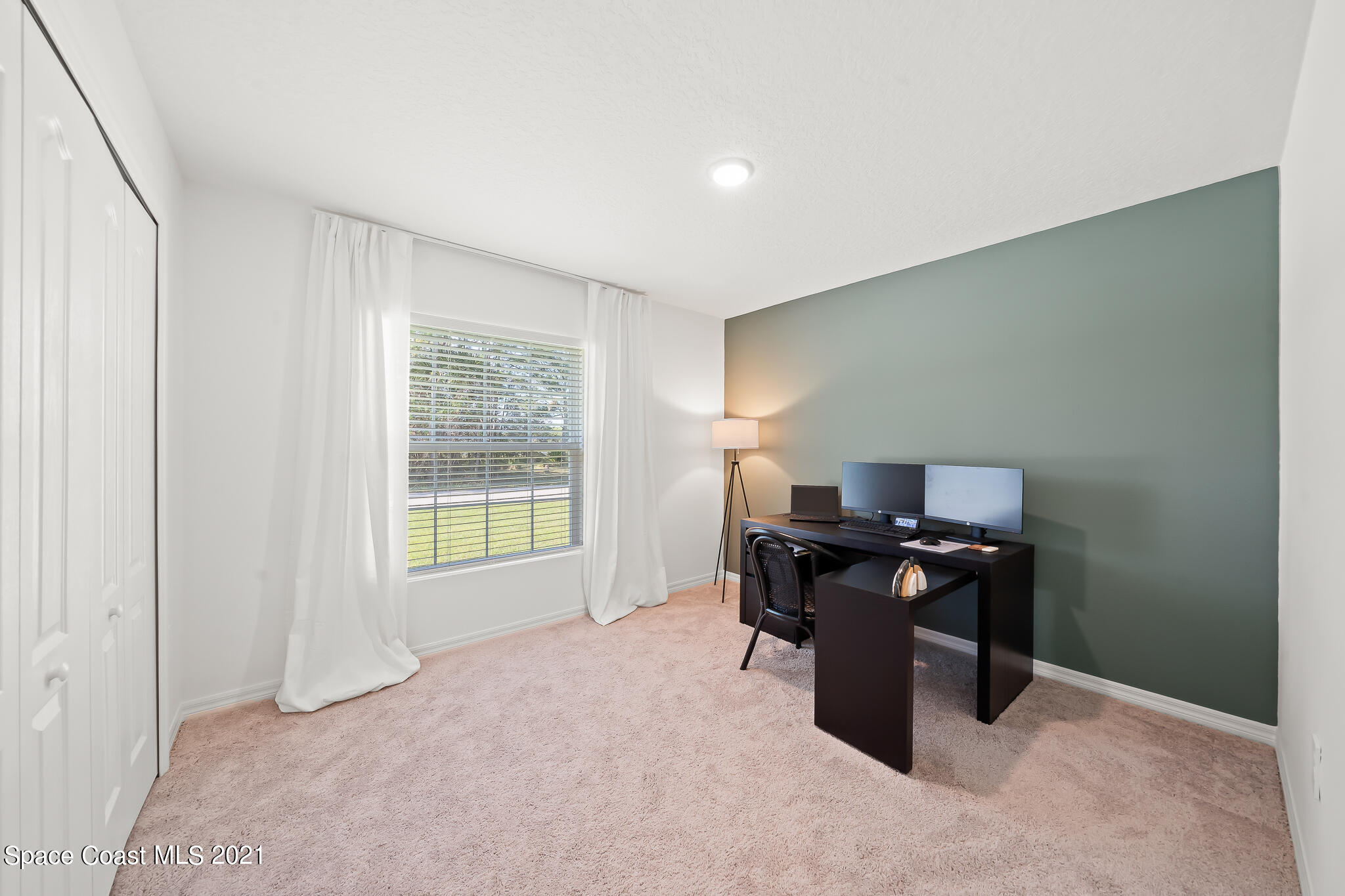 271 Wendover Road Southwest Palm Bay, FL 32908 - Photo 15 of 35 a workspace with furniture and window