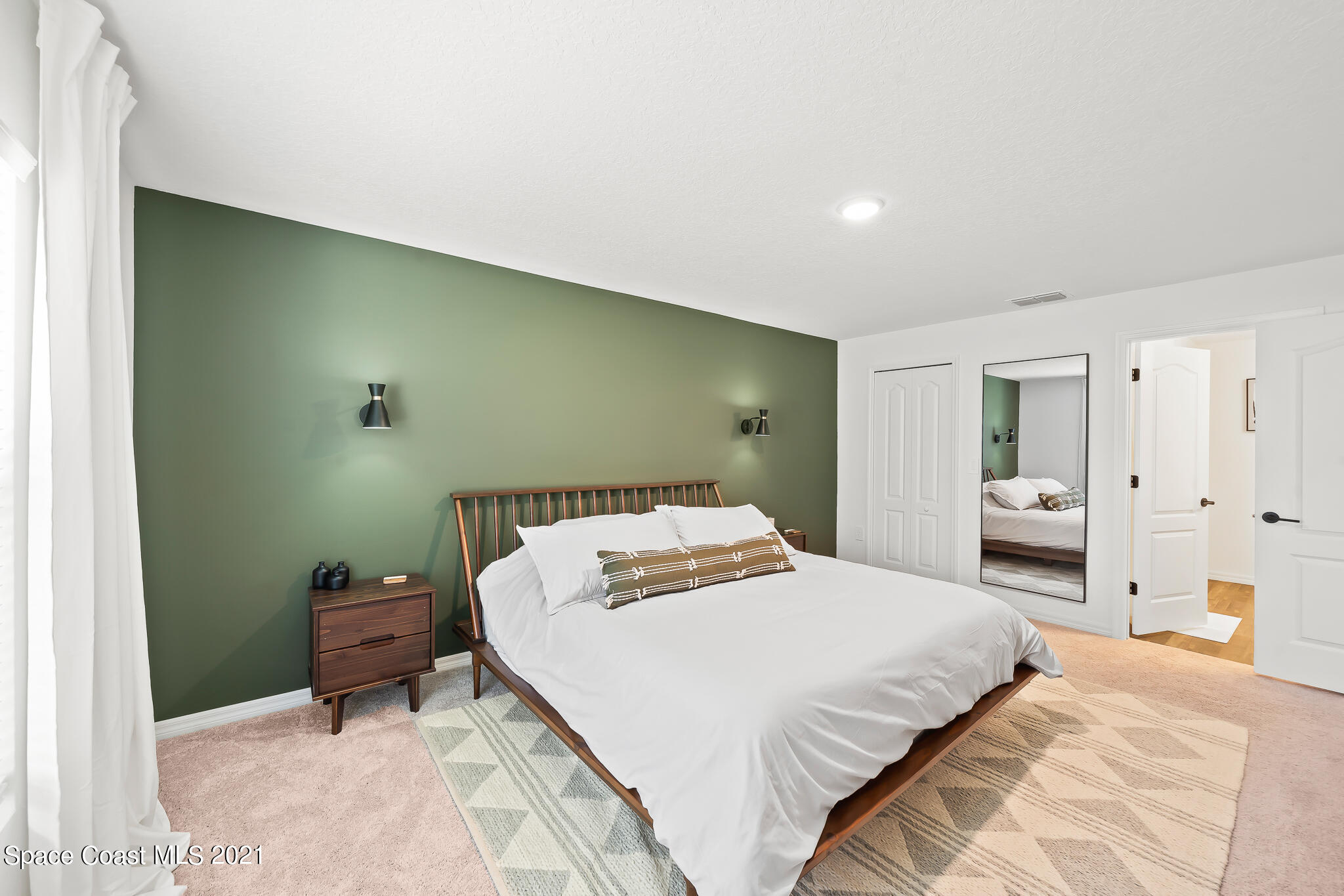 271 Wendover Road Southwest Palm Bay, FL 32908 - Photo 17 of 35 a bedroom with a bed and teddy bear on bed