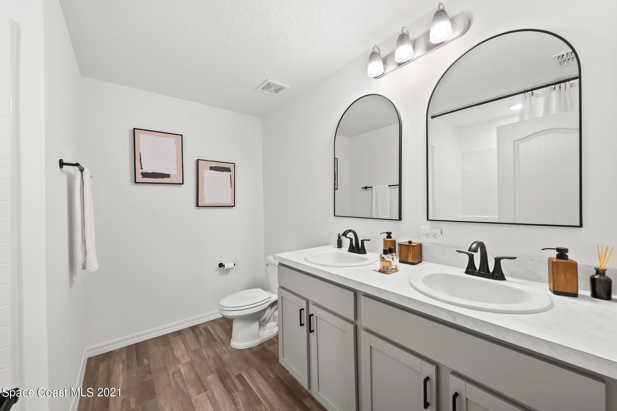 271 Wendover Road Southwest Palm Bay, FL 32908 - Photo 18 of 35 a bathroom with a sink and a mirror