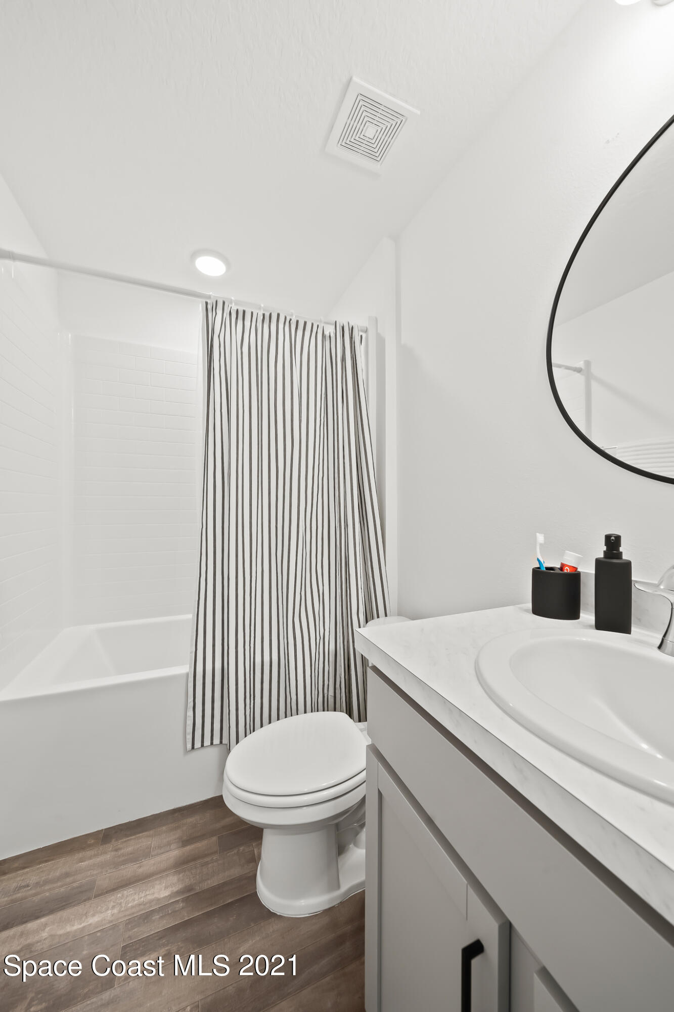 271 Wendover Road Southwest Palm Bay, FL 32908 - Photo 24 of 35 a bathroom with a sink a toilet and shower