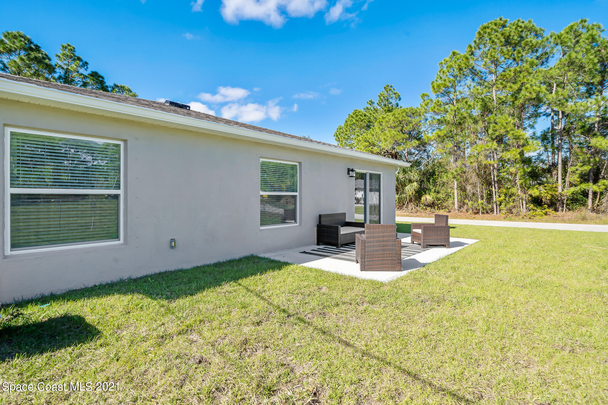 271 Wendover Road Southwest Palm Bay, FL 32908 - Photo 25 of 35 a view of a house with swimming pool and sitting area