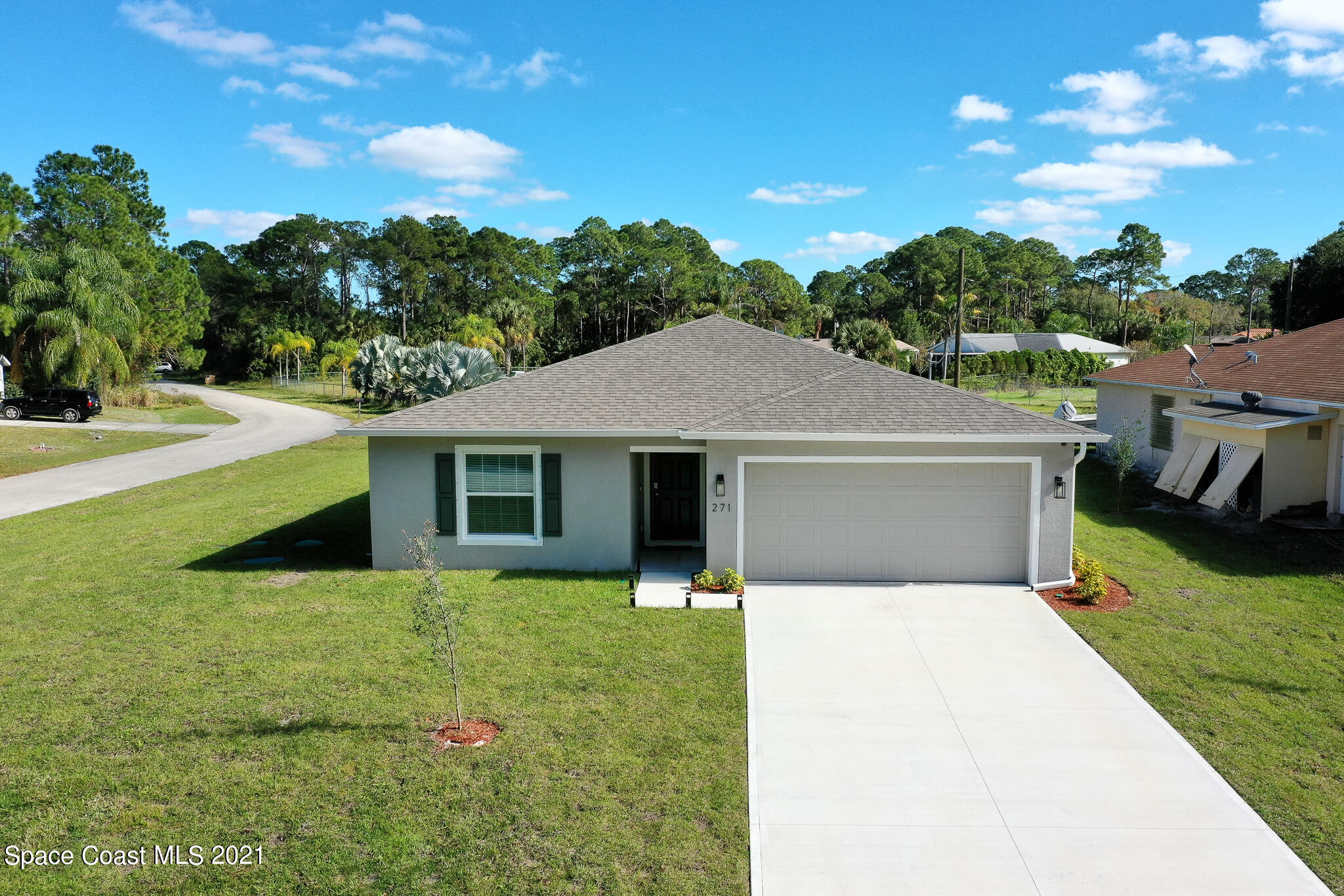 271 Wendover Road Southwest Palm Bay, FL 32908 - Photo 27 of 35 a front view of a house with yard