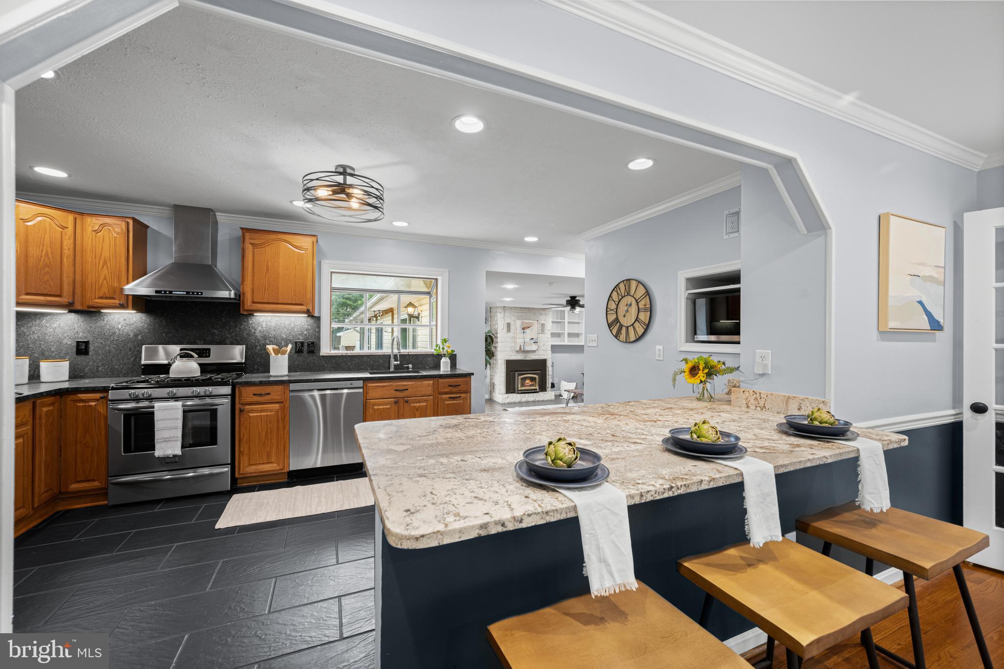 1410 Valley Creek Road Severn, MD 21144 - Photo 11 of 47 a kitchen with a table chairs and a stove