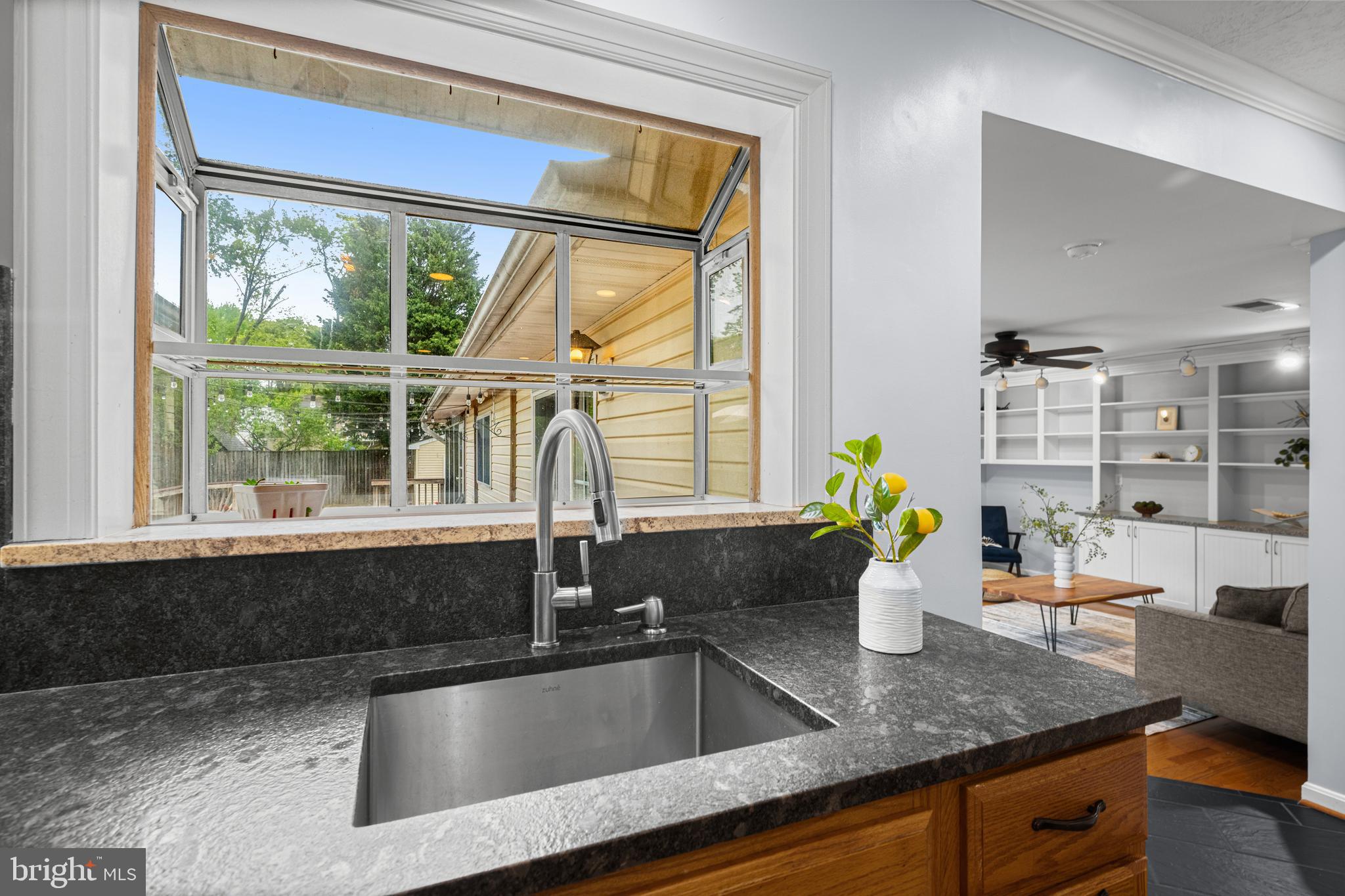 1410 Valley Creek Road Severn, MD 21144 - Photo 14 of 47 a kitchen counter with granite countertop a sink and a window