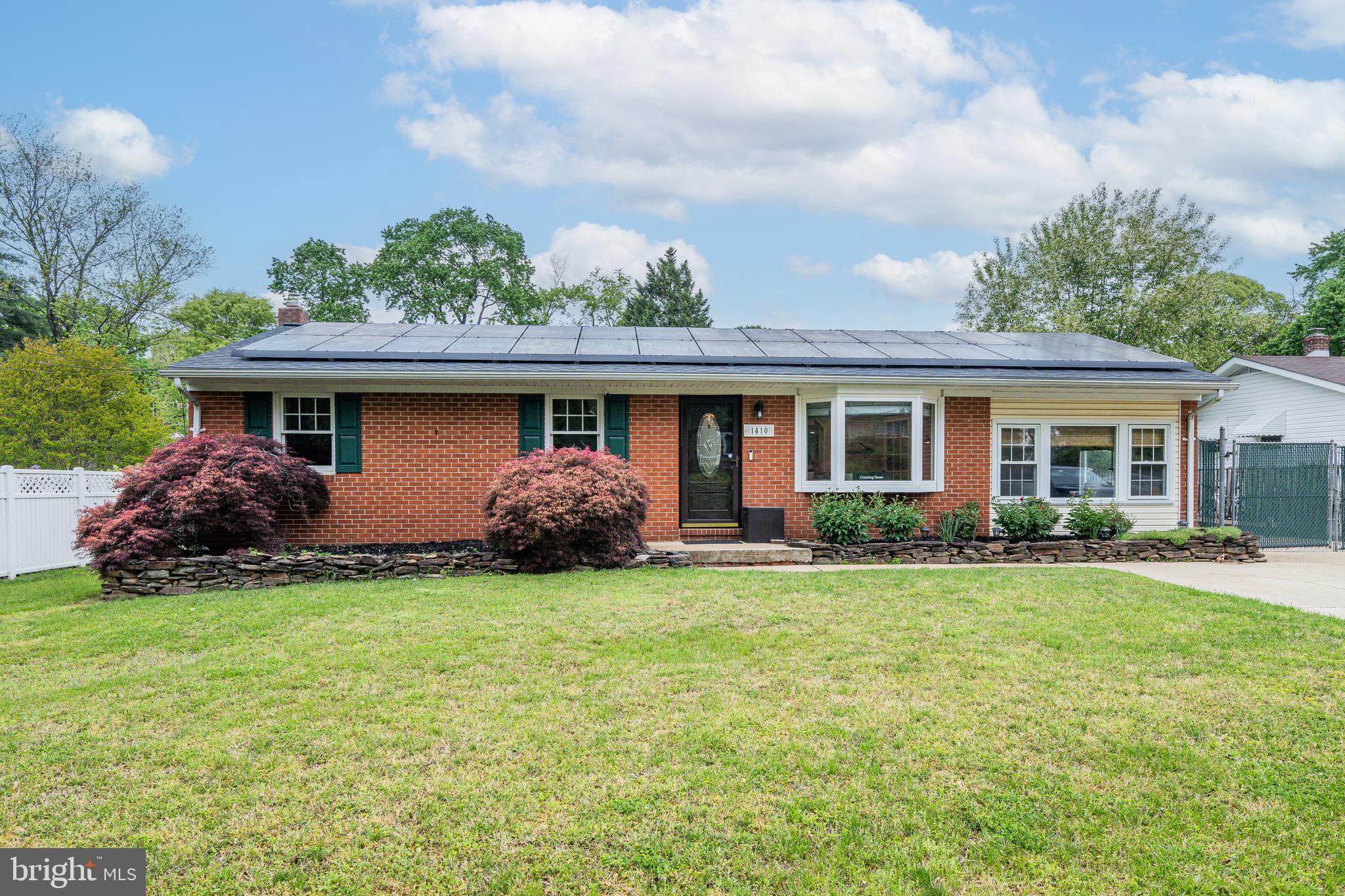 1410 Valley Creek Road Severn, MD 21144 - Photo 2 of 47 a front view of a house with a garden