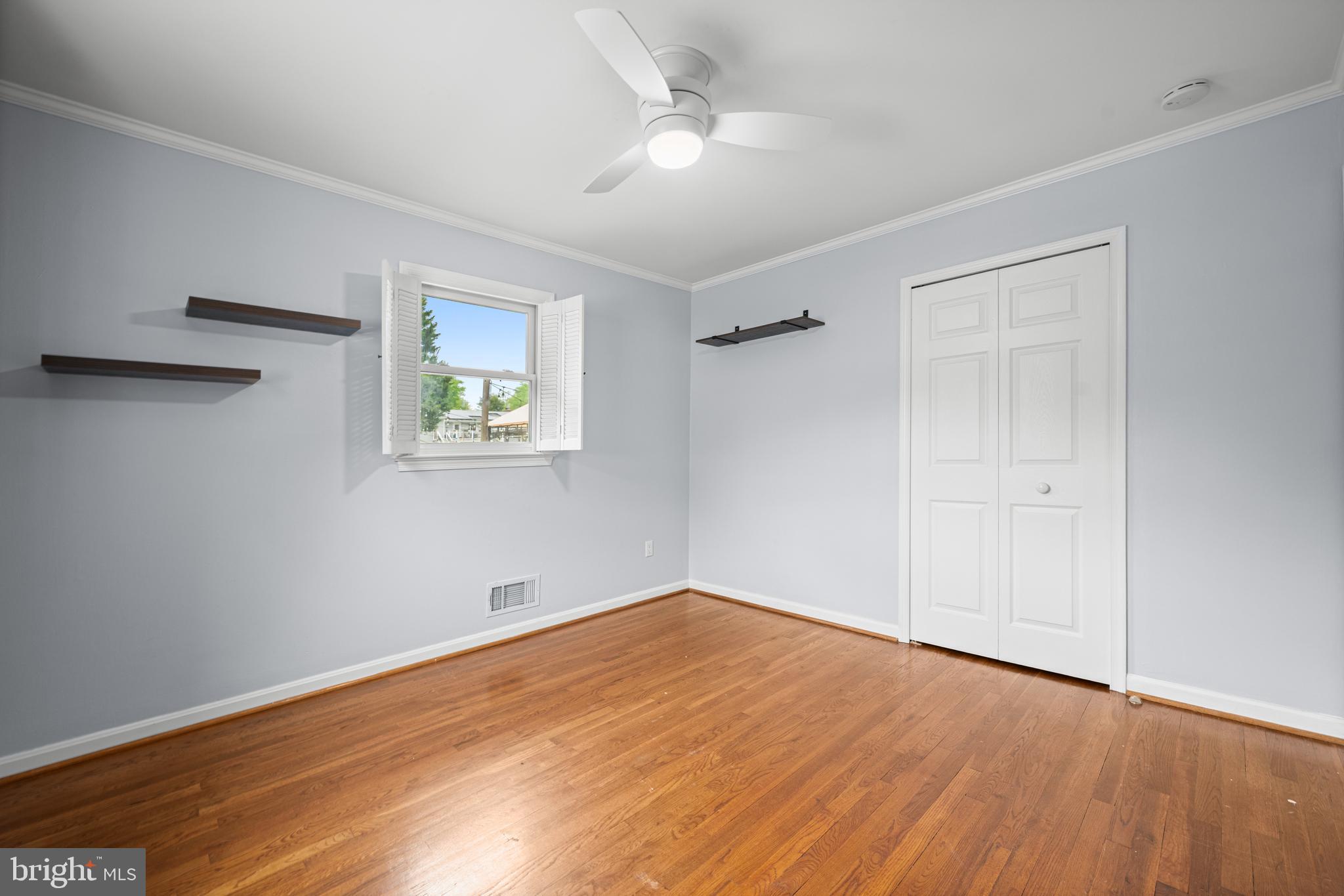 1410 Valley Creek Road Severn, MD 21144 - Photo 25 of 47 a view of empty room with wooden floor and fan