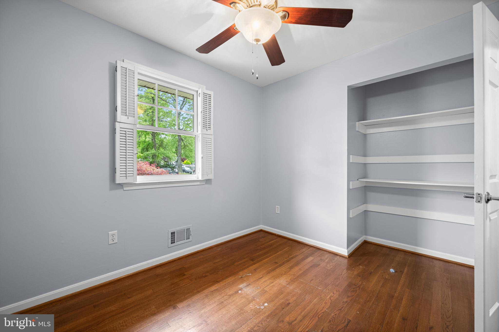 1410 Valley Creek Road Severn, MD 21144 - Photo 29 of 47 a view of a room with wooden floor and window