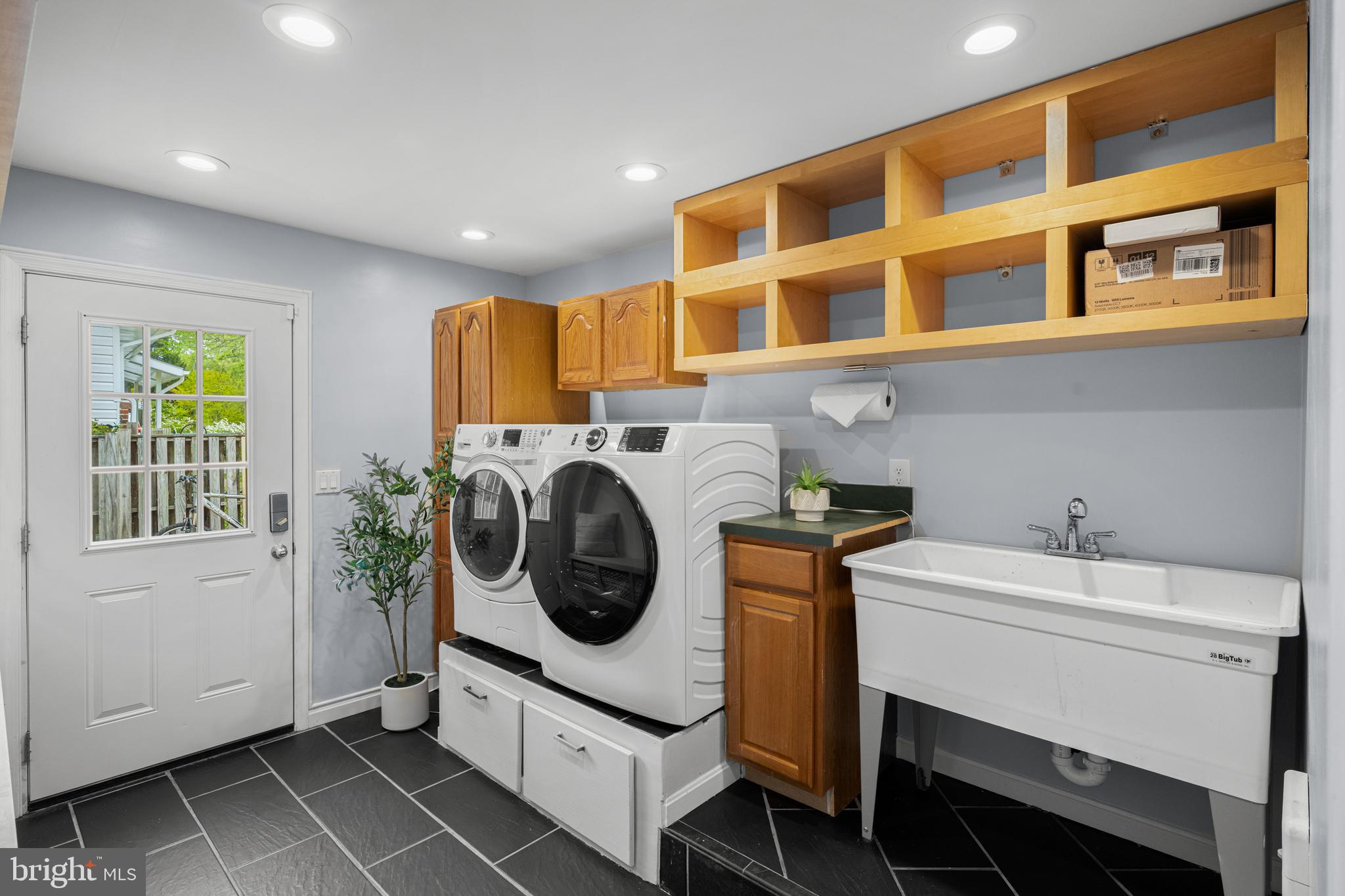 1410 Valley Creek Road Severn, MD 21144 - Photo 31 of 47 a utility room with dryer and washer