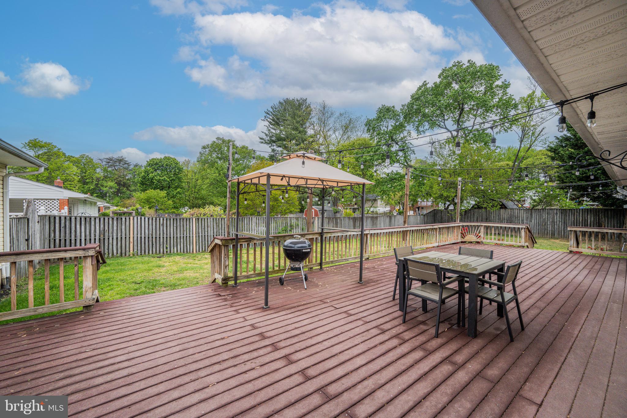 1410 Valley Creek Road Severn, MD 21144 - Photo 37 of 47 a view of a chairs and table on the wooden deck