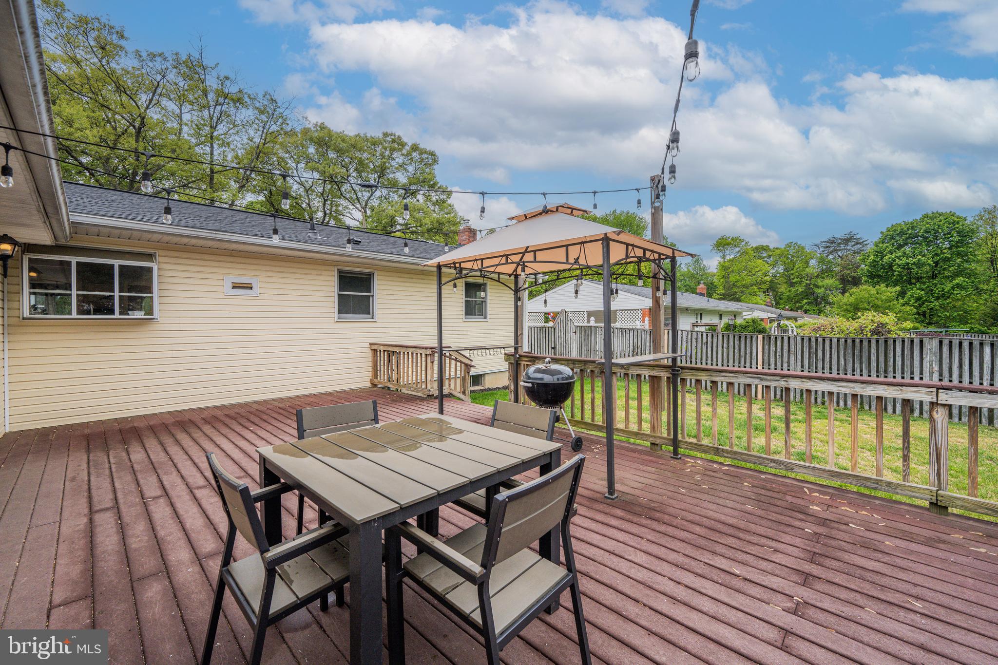 1410 Valley Creek Road Severn, MD 21144 - Photo 38 of 47 a view of a wooden deck with furniture