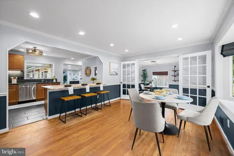 a view of a dining room kitchen with furniture and wooden floor