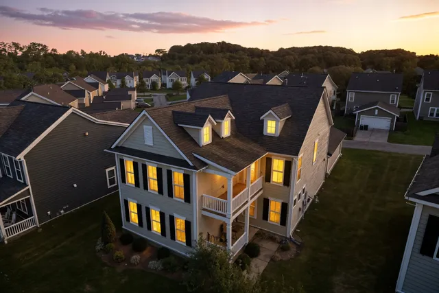 an aerial view of houses with a city street