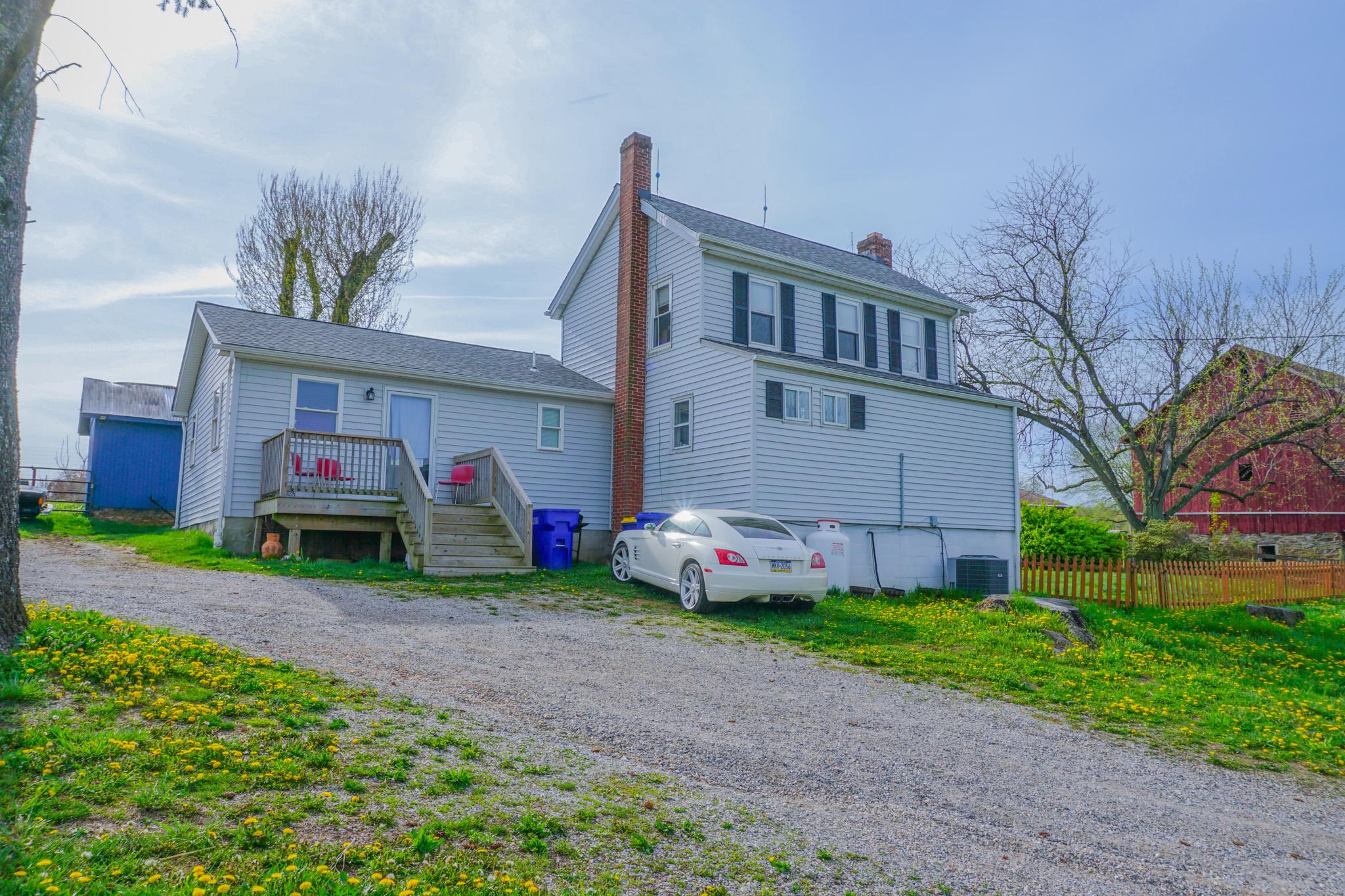14803 Mt Olivet Road Stewartstown, PA 17363 - Photo 2 of 81 a front view of house with yard and green space