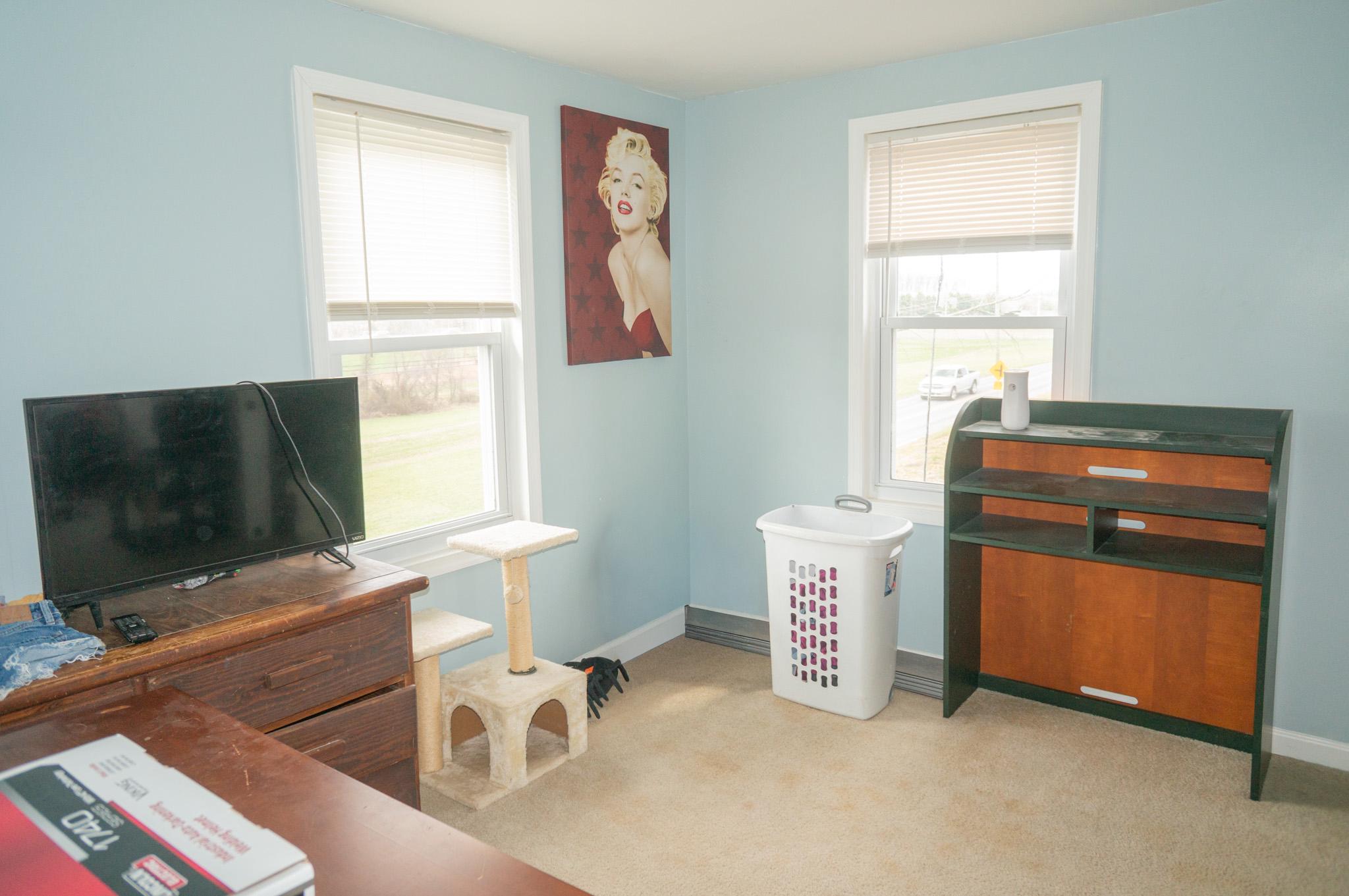 14803 Mt Olivet Road Stewartstown, PA 17363 - Photo 25 of 81 a room with furniture and a flat screen tv