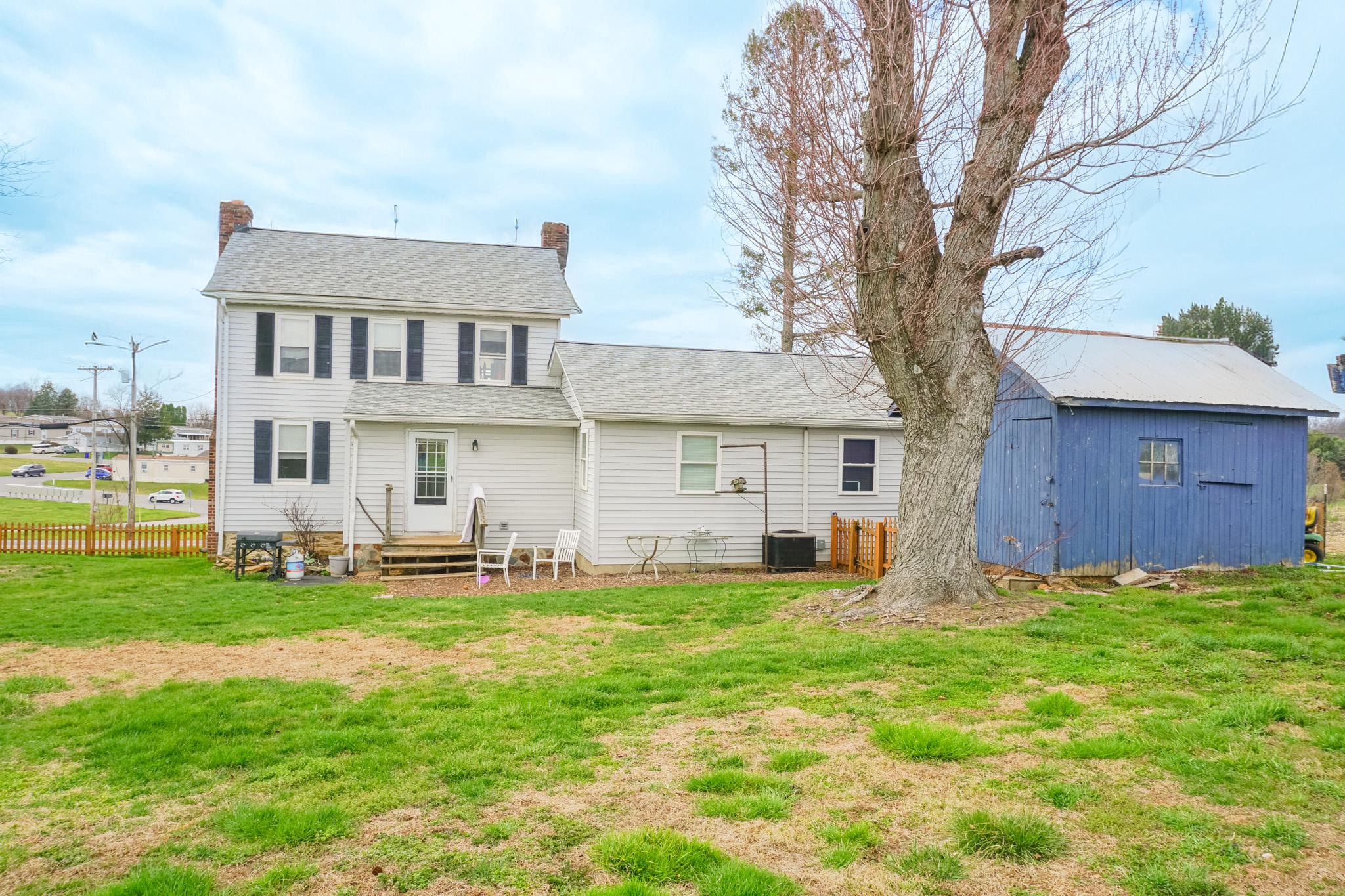 14803 Mt Olivet Road Stewartstown, PA 17363 - Photo 78 of 81 a view of a house with a yard and sitting area