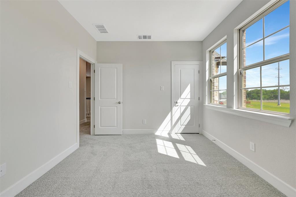 11460 Wulstone Road Fort Worth, TX 76052 - Photo 30 of 40 a view of an empty room with a window