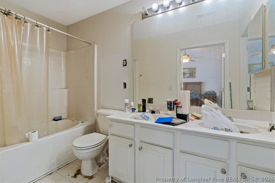 7233 Galon Glen Road Raleigh, NC 27613 - Photo 6 of 6 a bathroom with a sink a toilet and shower