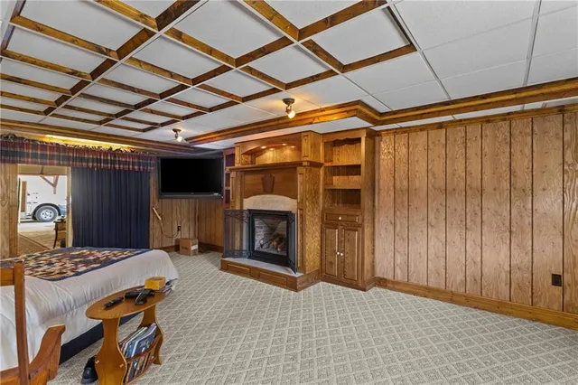 a bedroom with furniture and a window