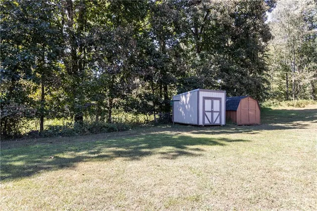 an aerial view of a house with yard