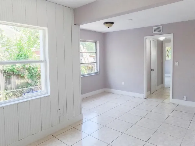 a bathroom with a sink a mirror and a bathtub