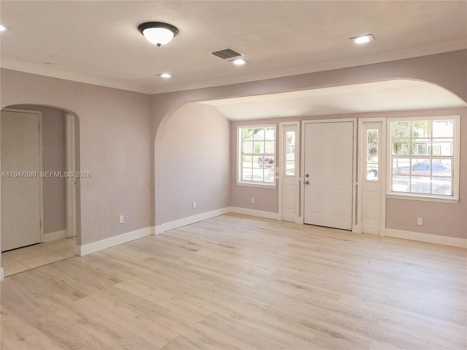 1051 Northwest 63rd Street Miami, FL 33150 - Photo 9 of 30 an empty room with windows and closet