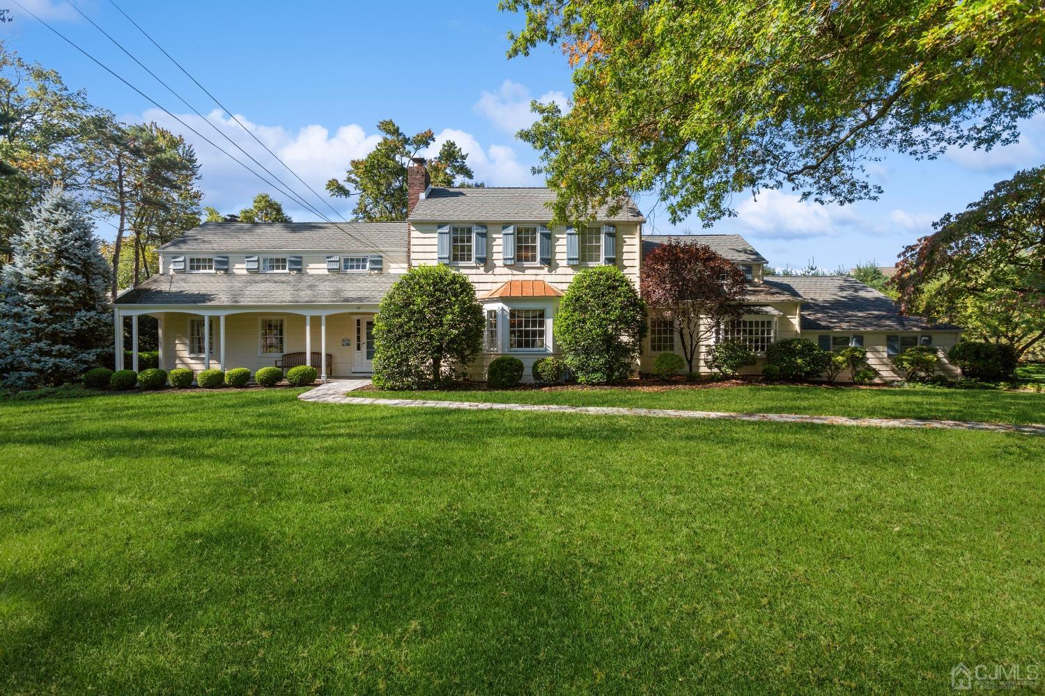 32 Oak Hills Road Edison, NJ 08820 - Photo 1 of 54 a front view of a building with a garden