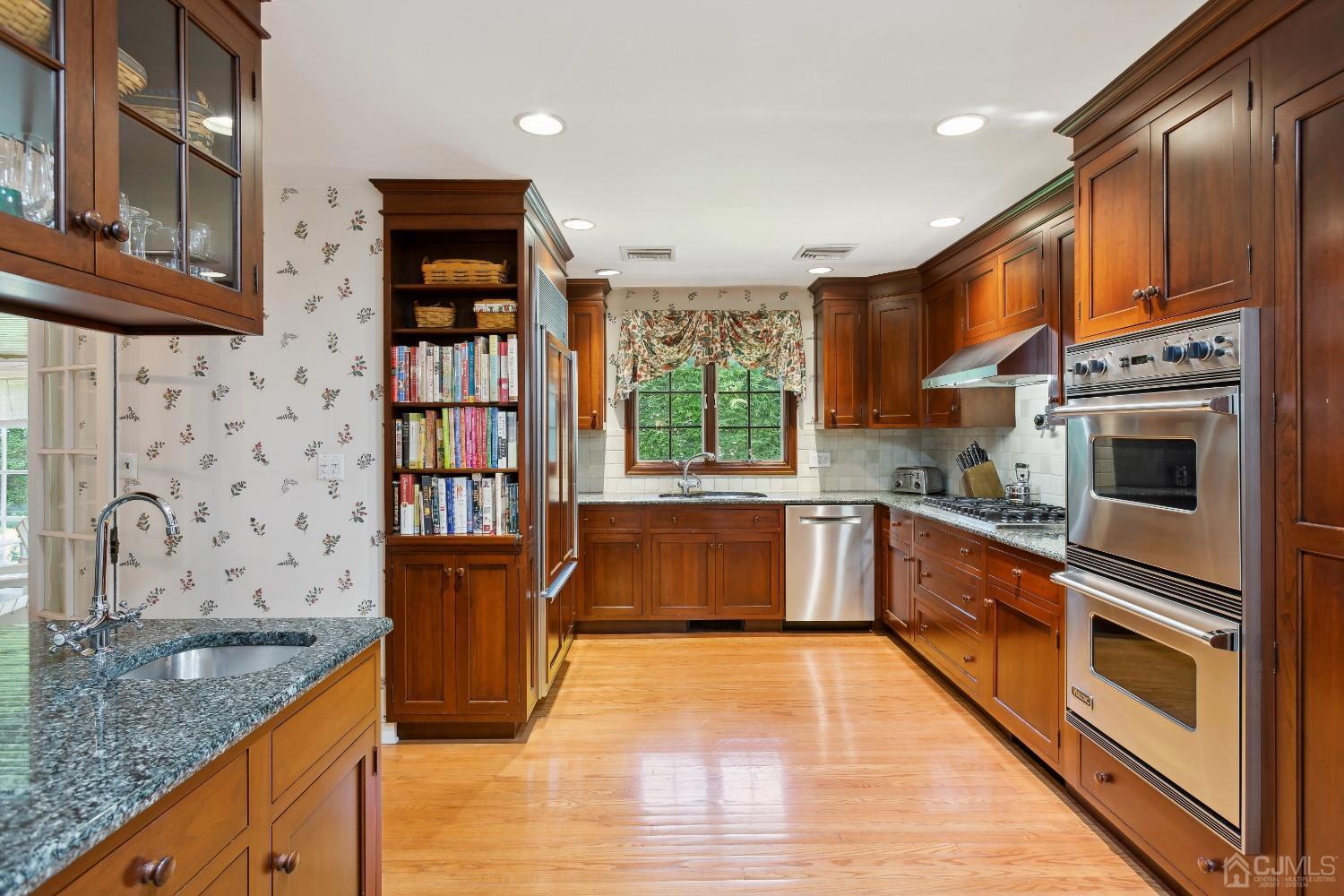32 Oak Hills Road Edison, NJ 08820 - Photo 20 of 54 a kitchen with stainless steel appliances granite countertop a stove a sink and a microwave