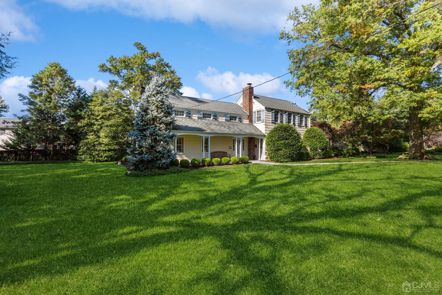 32 Oak Hills Road Edison, NJ 08820 - Photo 2 of 54 a front view of a house with a yard