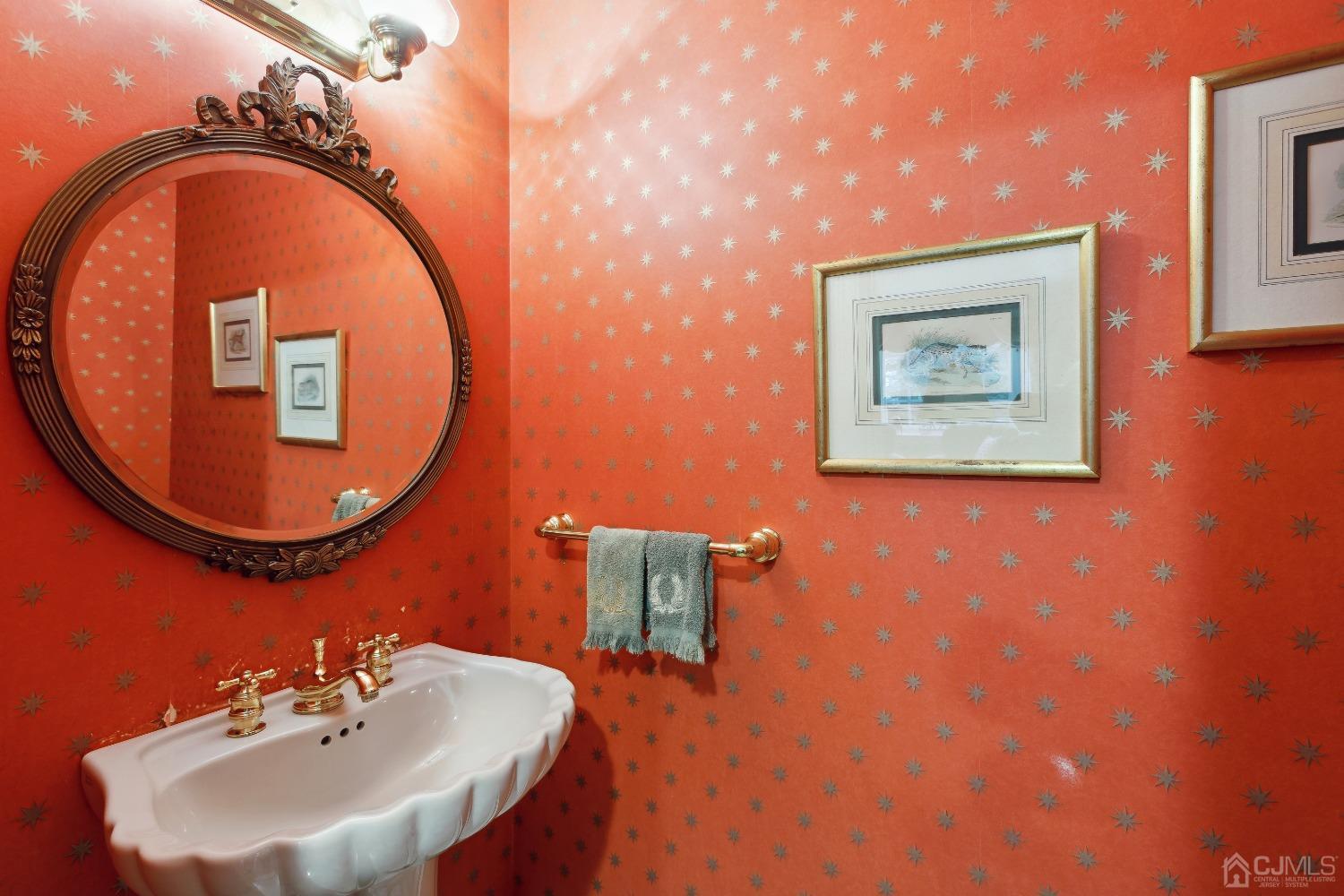 32 Oak Hills Road Edison, NJ 08820 - Photo 29 of 54 a bathroom with a sink and mirror