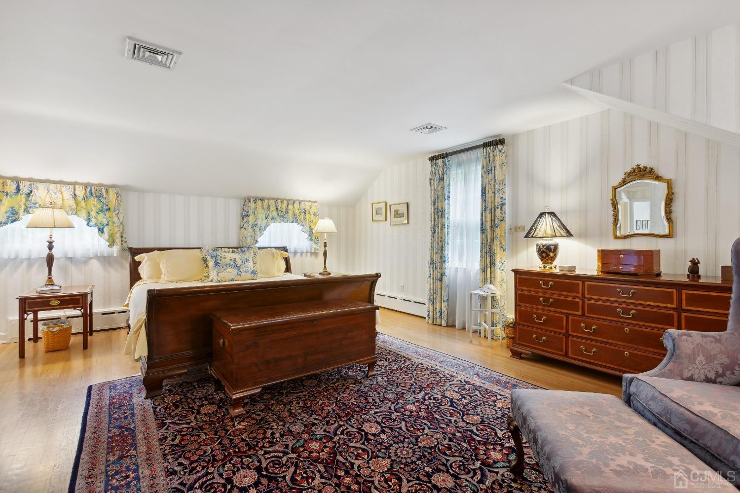 32 Oak Hills Road Edison, NJ 08820 - Photo 30 of 54 a bed room with furniture and a dresser