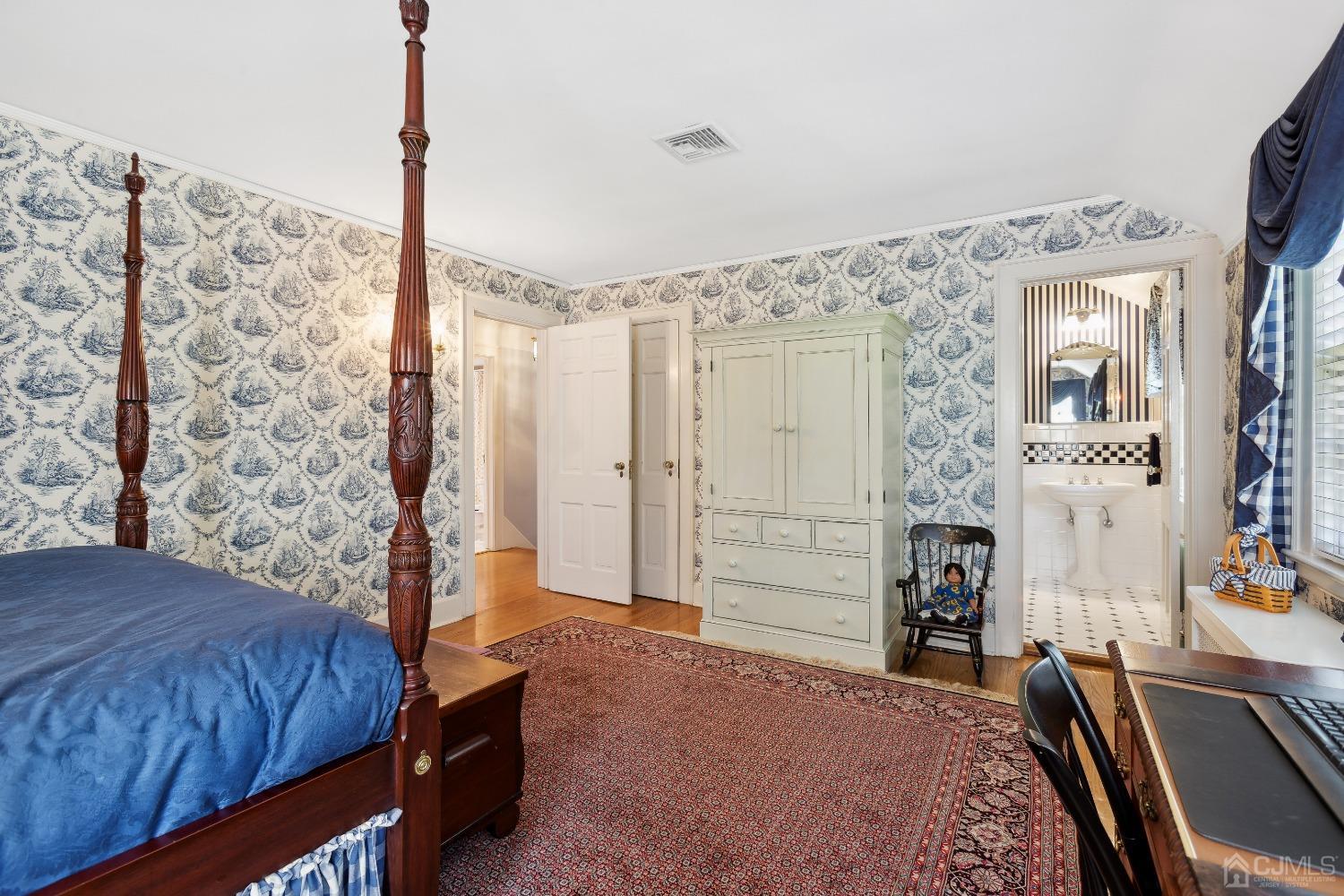 32 Oak Hills Road Edison, NJ 08820 - Photo 35 of 54 a bedroom with a bed dresser and a flat tv screen